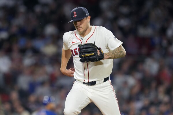 Boston Red Sox starting pitcher Tanner Houck heads to the dug out after retiring the side during the fifth inning of a baseball game against the Chicago Cubs, Sunday, April 28, 2024, in Boston. (AP Photo/Michael Dwyer)