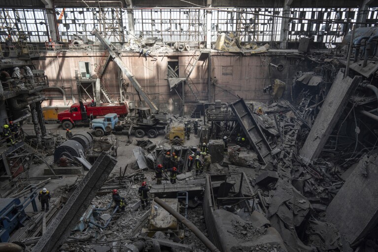 Rescue workers clear the rubble at DTEK's power plant which was destroyed by a Russian missile attack in Ukraine, on Monday, April 1, 2024. Russia is attacking Ukraine’s energy sector with renewed intensity and alarming accuracy, signaling to Ukrainian officials that Russia is armed with better intelligence and fresh tactics in its campaign to annihilate the country’s power generation capacity. (AP Photo/Evgeniy Maloletka)