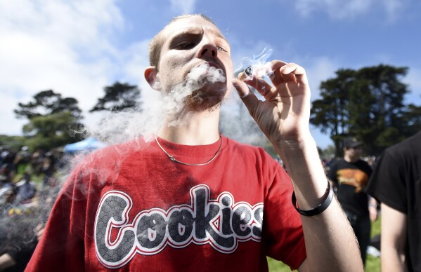 Kenny Boynton smokes a joint San Francisco, Calif., on Friday, April 20, 2018. (AP Photo/Josh Edelson, file)