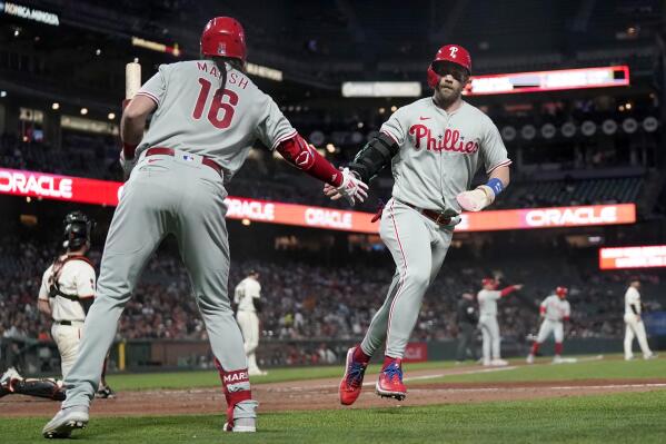 Philadelphia Phillies - Kyle Schwarber clapping his hands as he