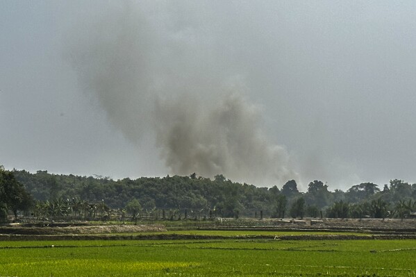 Smoke is seen bellowing from a Myanmar Border Police post following fighting between Myanmar security forces and Arakan Army, an ethnic minority army, in Ghumdhum, Bandarban, Bangladesh, on Monday, Feb. 5, 2024. Nearly a hundred members of Myanmar's Border Guard Police have fled their posts and taken shelter in Bangladesh during fighting between Myanmar security forces and an ethnic minority army, an official of Bangladesh's border agency said Monday. (AP Photo/Shafiqur Rahman)