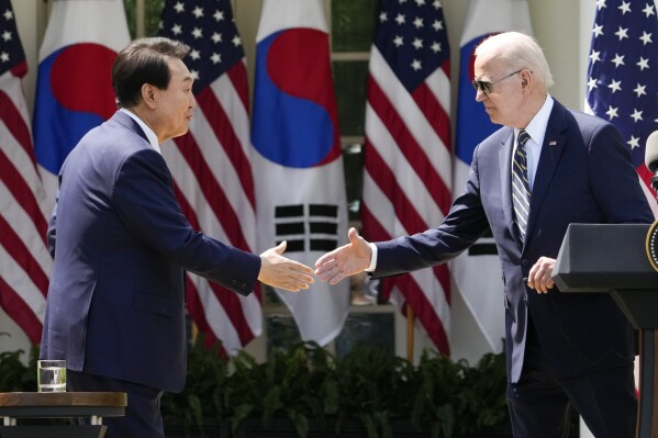 FILE - President Joe Biden and South Korea's President Yoon Suk Yeol shake hands during a news conference in the Rose Garden of the White House Wednesday, April 26, 2023, in Washington. Yoon says he will discuss international cooperation in response to the purported North Korean-Russian weapons deal during the Asia-Pacific Economic Cooperation summit in San Francisco this week. (AP Photo/Andrew Harnik, File)