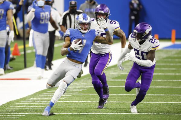 FILE - Detroit Lions wide receiver Marvin Jones (11) runs carries the ball as Minnesota Vikings outside linebacker Eric Wilson (50) and cornerback Jeff Gladney (20) chase in the first half of an NFL football game, Saturday, Jan. 3, 2021, in Detroit. The free agent receiver could not resist an opportunity to play in Detroit again for a franchise that suddenly has a favorable impression around the league. (AP Photo/Rick Osentoski, File)