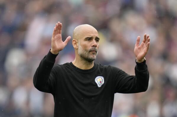 Manchester City's head coach Pep Guardiola reacts at the end of the English Premier League soccer match between West Ham United and Manchester City at London stadium in London, Sunday, May 15, 2022. (AP Photo/Kirsty Wigglesworth)