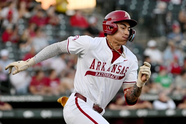 Arkansas batter Wehiwa Aloy (9) runs to first base against Little Rock during an NCAA college baseball game on Tuesday, April 22, 2025, in Fayetteville, Ark. (AP Photo/Michael Woods, File)