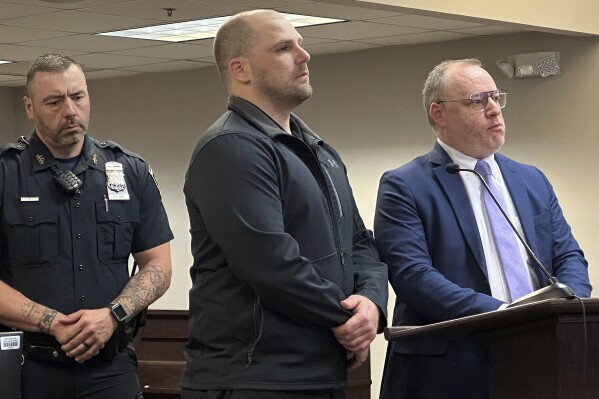 Correctional officer Christopher Walrath, center, appears in Oneida County Court, Monday, May 5, 2025, in Utica, N.Y., to enter a guilty plea for manslaughter in the December 2024 death of inmate Robert Brooks. (AP Photo/Michael Hill)