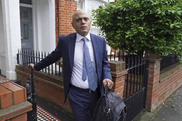 Lawmaker Sajid Javid, leaves his home in London, Monday June 28, 2021, after being appointed as Secretary of State for Health and Social Care, following the resignation of Matt Hancock over the weekend.  Javid is expected to make his first statement inside the government as health minister later Monday. (Jonathan Brady/PA via AP)