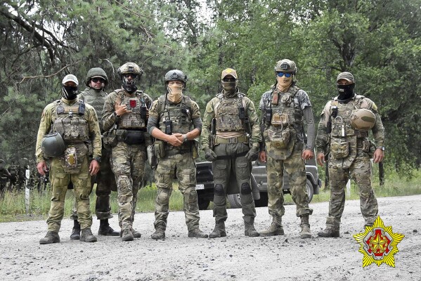 FILE - In this photo released by Belarus' Defense Ministry on July 20, 2023, Belarusian soldiers and mercenaries from Russia’s Wagner private military company pose for a photo amid maneuvers at a firing range near the border city of Brest, Belarus. (Belarus' Defense Ministry via AP, File)