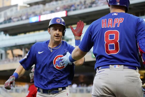 Chicago Cubs' Frank Schwindel, left, is congratulated by Ian Happ after Schwindel's solo home run off Minnesota Twins pitcher John Gant in the first inning of a baseball game, Tuesday, Aug. 31, 2021, in Minneapolis. (AP Photo/Jim Mone)