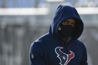 FILE - Texans quarterback Deshaun Watson arrives at NFL football practice Saturday, July 31, 2021, in Houston. The NFL suspended Watson for six games on Monday, Aug. 1, 2022 for violating its personal conduct policy following accusations of sexual misconduct made against him by two dozen women in Texas, two people familiar with the decision said. (AP Photo/Justin Rex, FIle)