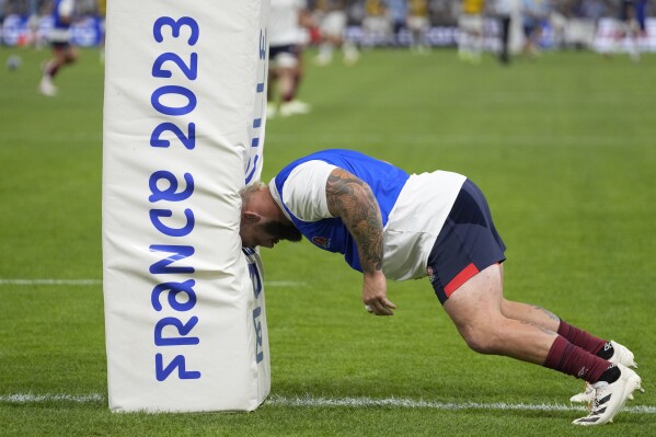 England's Joe Marler takes part in the warm up ahead of the Rugby World Cup Pool D match between England and Argentina in the Stade de Marseille, Marseille, France Saturday, Sept. 9, 2023. (AP Photo/Pavel Golovkin)