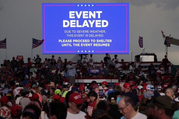 Supporters of former President Donald Trump file out of the rally after it was canceled due to threatening weather in Wilmington, N.C., Saturday, April 20, 2024. (AP Photo/Chris Seward)