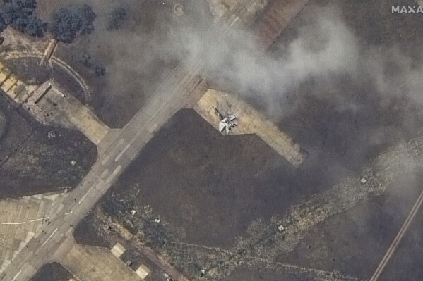 This image released by Maxar Technologies shows a damaged plane, likely a MiG 31 fighter aircraft, at Belbek air base, near Sevastopol, in Crimea, Thursday, May 16, 2024. (Satellite image ©2024 Maxar Technologies via AP)