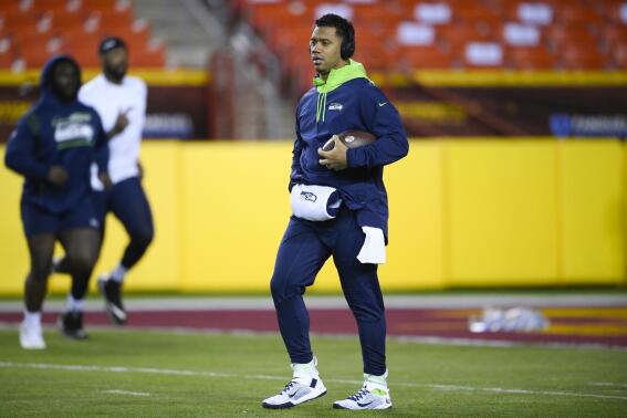 Seattle Seahawks quarterback Russell Wilson (3) walking on the field prior to the start of the first half of an NFL football game against the Washington Football Team, Monday, Nov. 29, 2021, in Landover, Md. (AP Photo/Nick Wass)