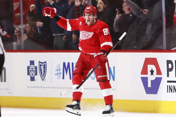 Detroit Red Wings right wing Patrick Kane celebrates his overtime goal against the Columbus Blue Jackets in an NHL hockey game Tuesday, March 19, 2024, in Detroit. (AP Photo/Duane Burleson)