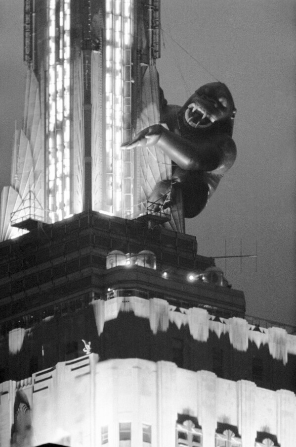 FILE - The eight-story ape King Kong glares down at Manhattan from the Empire State Building, April 14, 1983, in New York. Films from Hollywood’s talkie era have begun to become public. King Kong, who has a large foot in the public domain already because of complications between companies that own a piece of him, will lose his remaining chains in 2029. (AP Photo/Ron Frehm, File)