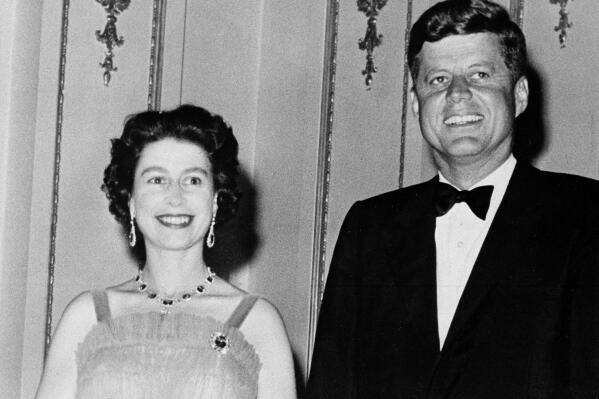 FILE - Queen Elizabeth II and U.S. President John Kennedy as they pose at Buckingham Palace in London, June 5, 1961. The Kennedy's were dinner guests of the Queen. Queen Elizabeth II, Britain's longest-reigning monarch and a rock of stability across much of a turbulent century, died Thursday, Sept. 8, 2022, after 70 years on the throne. She was 96. (AP Photo, File)