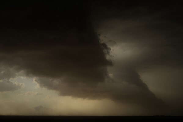 Storm clouds form during a Project ICECHIP operation Friday, June 6, 2025, in Morton, Texas. (AP Photo/Carolyn Kaster)