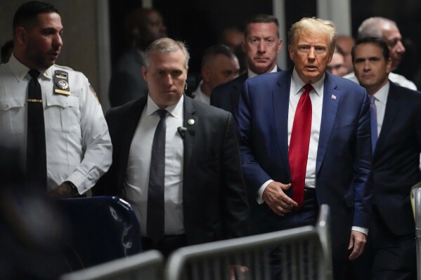 FILE - Former President Donald Trump leaves Manhattan criminal court, Feb. 15, 2024, in New York. Judge Juan Manuel Merchan agreed Friday, March 16, to delay former President Donald Trump’s hush-money criminal trial in New York until mid-April after his lawyers said they needed more time to sift through new evidence. (AP Photo/Mary Altaffer, File)
