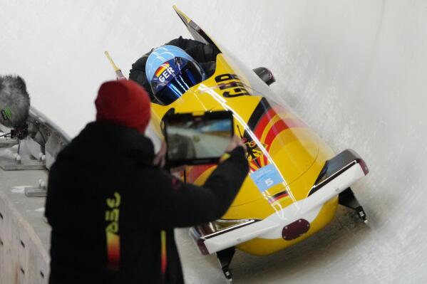 Francesco Friedrich of Germany and his team drive their 4-man bobsled during a training heat at the 2022 Winter Olympics, Thursday, Feb. 17, 2022, in the Yanqing district of Beijing. (AP Photo/Dmitri Lovetsky)