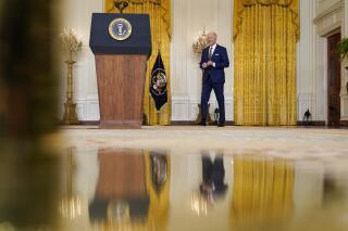 President Joe Biden arrives to speaks at a news conference in the East Room of the White House in Washington, Wednesday, Jan. 19, 2022. (AP Photo/Susan Walsh)