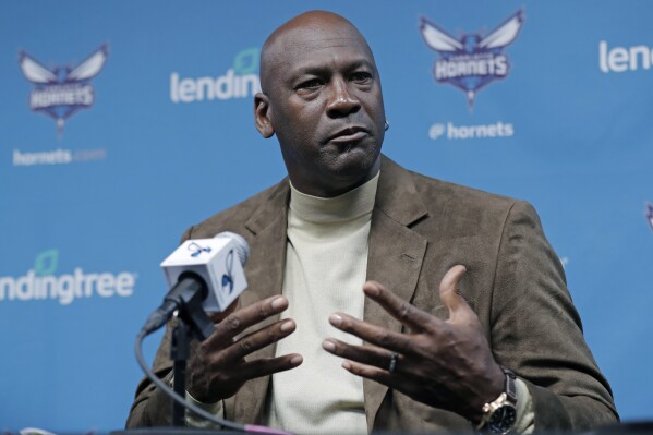 FILE - Charlotte Hornets owner Michael Jordan speaks to the media about hosting the NBA All-Star basketball game during a news conference in Charlotte, N.C., Tuesday, Feb. 12, 2019. Michael Jordan is finalizing a deal to sell the majority share of the Charlotte Hornets, a move that will end his 13-year run overseeing the organization, the team announced Friday, June 16, 2023. Jordan is selling to a group led by Gabe Plotkin and Rick Schnall, the Hornets said. (AP Photo/Chuck Burton, File)