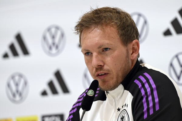 Germany's head coach Julian Nagelsmann attends a press conference of the German national soccer team in Herzogenaurach, Germany, Sunday, June 2, 2024, ahead of the European Championship test match between Germany and Ukraine on Monday, June 3. Nagelsmann says he was shocked by a public broadcaster’s survey that asked participants if they would prefer more white players on his team. (Federico Gambarini/dpa via AP)