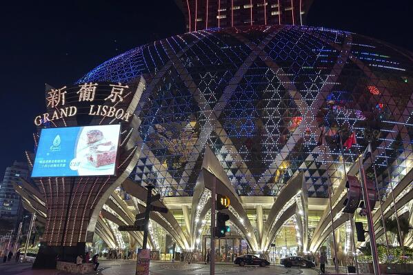 Grand Lisboa casino is seen in Macao on Dec. 28, 2022. Gambling haven Macao’s relaxation of border restrictions after China rolled back its "zero-COVID" strategy is widely expected to boost its tourism-driven economy. The gaming hub on China's south coast near Hong Kong has endured some of the world’s strictest anti-virus controls for nearly three years. Now, China's worst wave of infections so far is keeping away the hoards of high rollers who usually fill its casinos. (AP Photo/Kanis Leung)