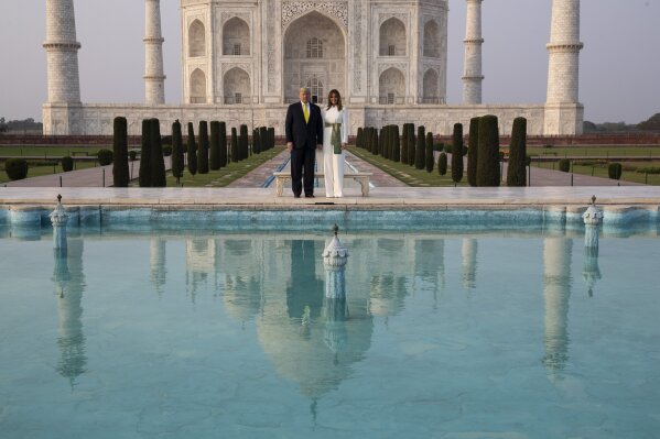 President Donald Trump, with first lady Melania Trump, pause as they tour the Taj Mahal, Monday, Feb. 24, 2020, in Agra, India. (AP Photo/Alex Brandon)