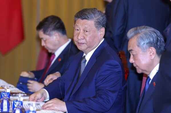 Chinese President Xi Jinping, center, attends a meeting with Vietnamese President Luong Cuong, unseen, at the Presidential Palace in Hanoi, Vietnam, Tuesday, April 15, 2025. (AP Photo/Minh Hoang, Pool)