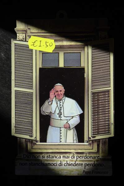 A religious souvenir depicting Pope Francis in Rome, Thursday, May 1, 2025. (AP Photo/Bernat Armangue)