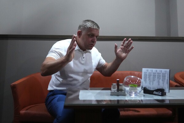 Former Slovak Prime Minister and head of leftist SMER - Social Democracy party Robert Fico gestures during an interview with The Associated Press prior his election rally in Michalovce, Slovakia, Wednesday, Sept. 6, 2023. Fico, who led Slovakia from 2006 to 2010 and again from 2012 to 2018, might reclaim the prime minister's office after the Sept. 30 election. He and his left-wing Direction ("Smer")-Social Democracy party have campaigned on a clear pro-Russian and anti-American message. (AP Photo/Petr David Josek)
