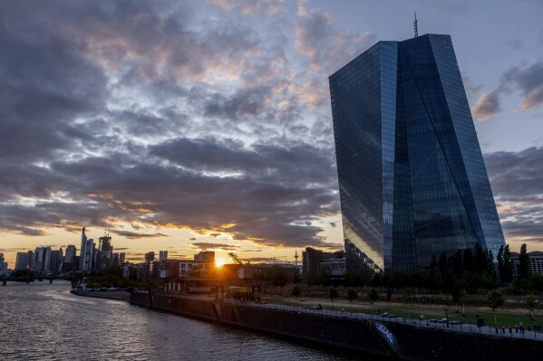 The sun sets next to the European Central Bank in Frankfurt, Germany, Monday, July 24, 2023. The European Central Bank is set to raise interest rates again Thursday. Economists are saying it could be the last hike in a rapid-fire series that started a year ago. (AP Photo/Michael Probst)