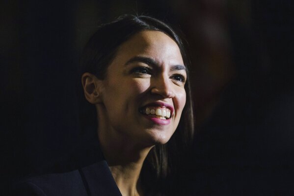 
              FILE - In this Saturday, Feb. 16, 2019 file photo, Rep. Alexandria Ocasio-Cortez, D-N.Y., delivers her inaugural address following her swearing-in ceremony at the Renaissance School for Musical Theater and Technology in the Bronx borough of New York. Democrats hoping to unseat President Donald Trump in 2020 are courting the party’s famous freshmen, including Ocasio-Cortez and those from early voting states such as New Hampshire, South Carolina and Iowa. (AP Photo/Kevin Hagen, File)
            