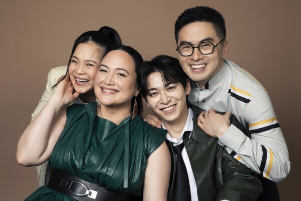 Cast members, from left, Kelly Marie Tran, Lily Gladstone, Han Gi-Chan, and Bowen Yang pose for a portrait to promote their film, "The Wedding Banquet," on Tuesday, April 15, 2025, in West Hollywood, Calif. (Photo by Rebecca Cabage/Invision/AP)