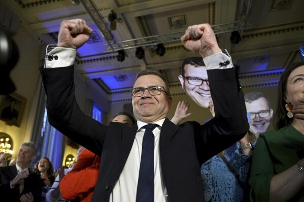 National Coalition Chairman Petteri Orpo celebrates at the party's parliament election wake after seeing the results of the advance votes in Helsinki, Finland, Sunday, April 2, 2023. A general election in Finland was expected to result in a close finish by three political parties Sunday, with Prime Minister Sanna Marin’s Social Democrats fighting to secure a second term running the government. (Antti Aimo-Koivisto/Lehtikuva via AP)