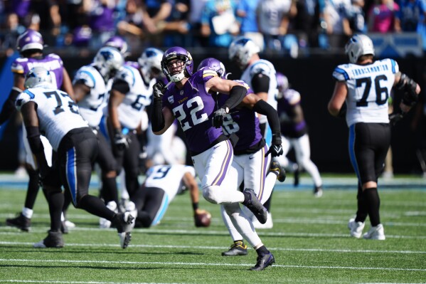 Minnesota Vikings safety Harrison Smith celebrates after sacking Carolina Panthers quarterback Bryce Young during the second half of an NFL football game Sunday, Oct. 1, 2023, in Charlotte, N.C. (AP Photo/Jacob Kupferman)